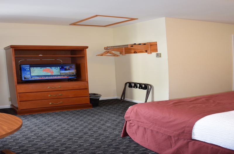 Flat Screen TV in motel room with bed