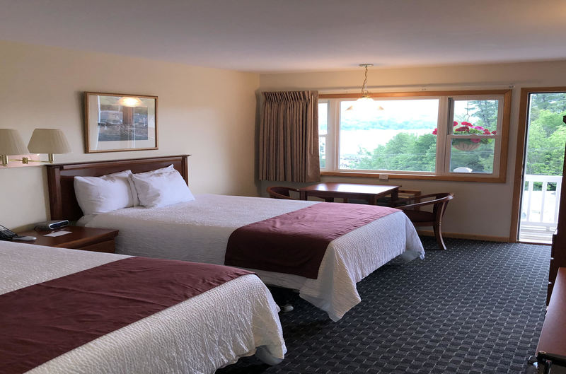 2 Queen Beds, Table, Flatscreen TV, Fridge, Coffee maker, and Balcony with lake view