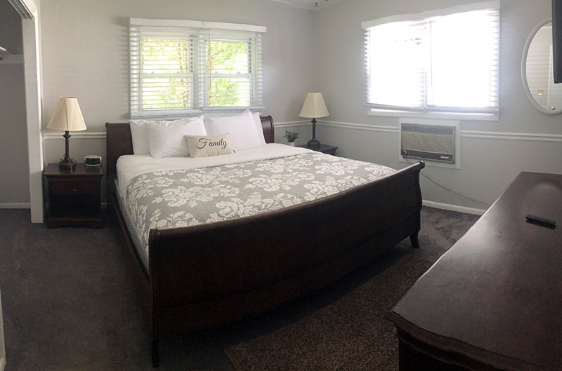 Lake view apartment bedroom featuring King size bed